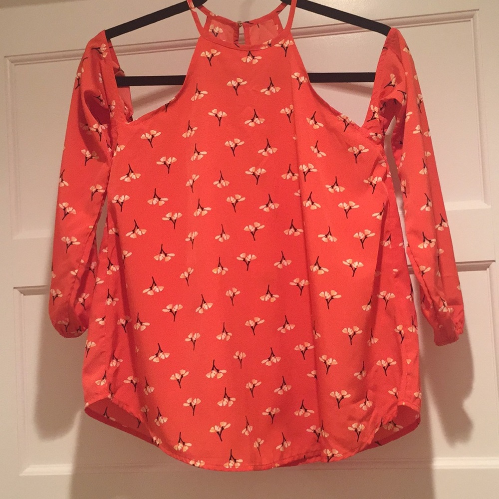 Melon colored blouse with floral patter